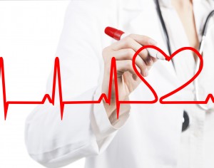 Doctor drawing a heart beats ECG