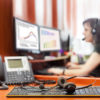 call center with young woman and headpones